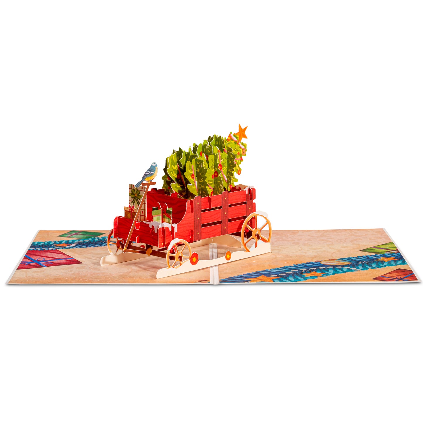 Open pop-up card displaying a red wagon with a Christmas tree and decorations.