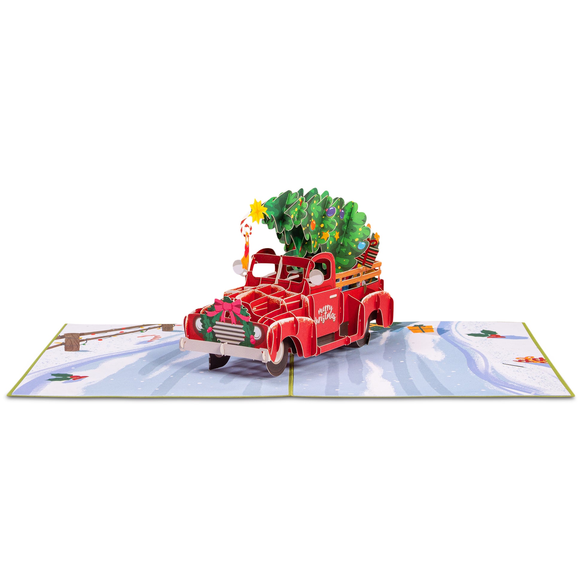 Fully opened Christmas pop-up card with a red truck and festive winter scene.