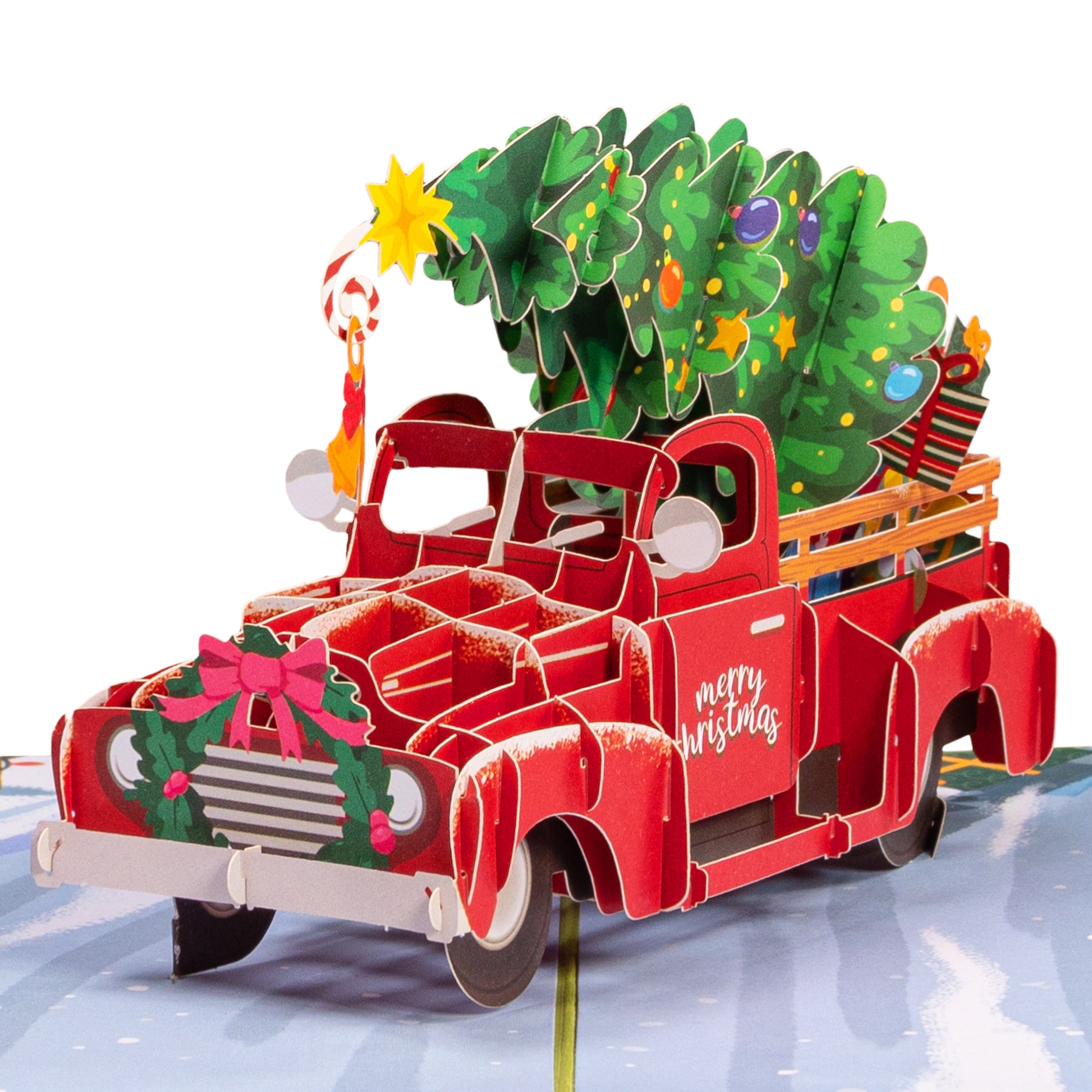 Close-up of the red truck pop-up design with a Christmas tree and gifts.