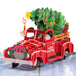 Close-up of the red truck pop-up design with a Christmas tree and gifts.