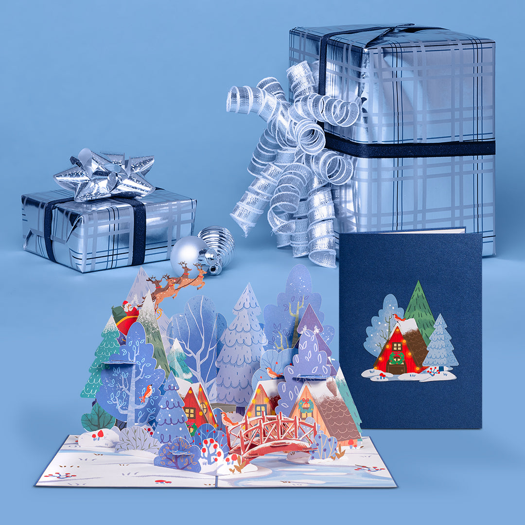 Magical Town Christmas pop-up card displayed with wrapped gifts and ornaments.