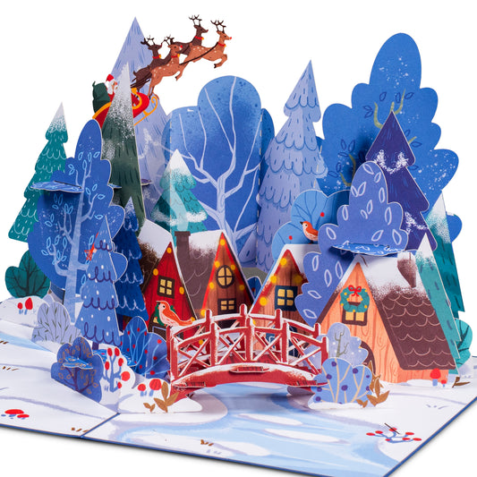 Magical Town Christmas pop-up card featuring a festive village with snowy trees and Santa's sleigh.