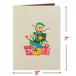 Front cover of Christmas pop-up card featuring cheerful elves and gifts.