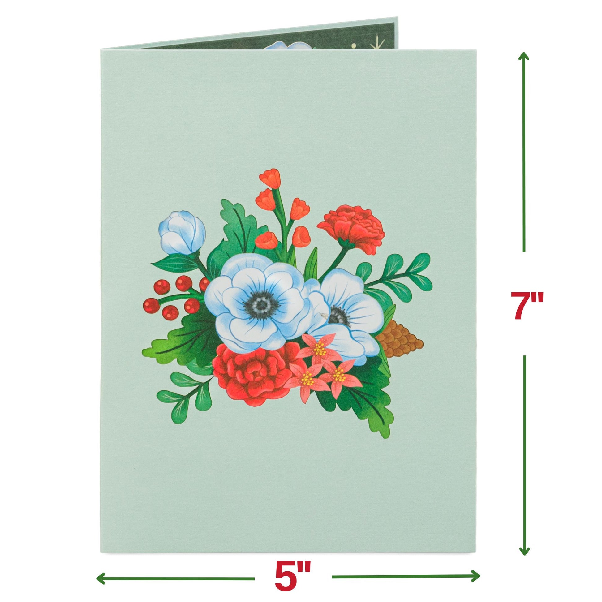 Front cover of Christmas card featuring floral design with red and white flowers.