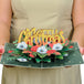 Person holding a Floral Merry Christmas pop-up card with intricate festive details.