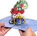 Hands opening the Elf Gnome pop-up card revealing the 3D gnome design.